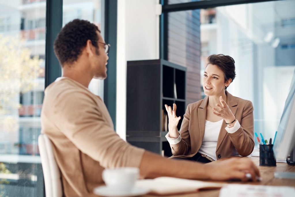 mentor, training and a woman manager with an employee in the office for coaching on company vision. management, meeting and a female business person talking to a professional male colleague at work